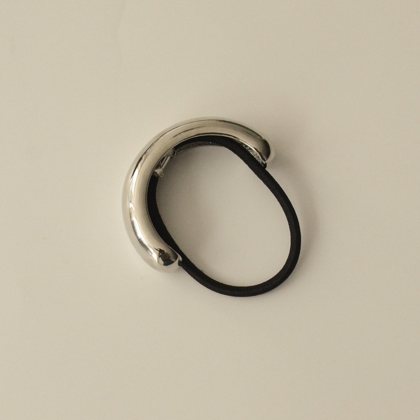 top view of silver cuff hair tie