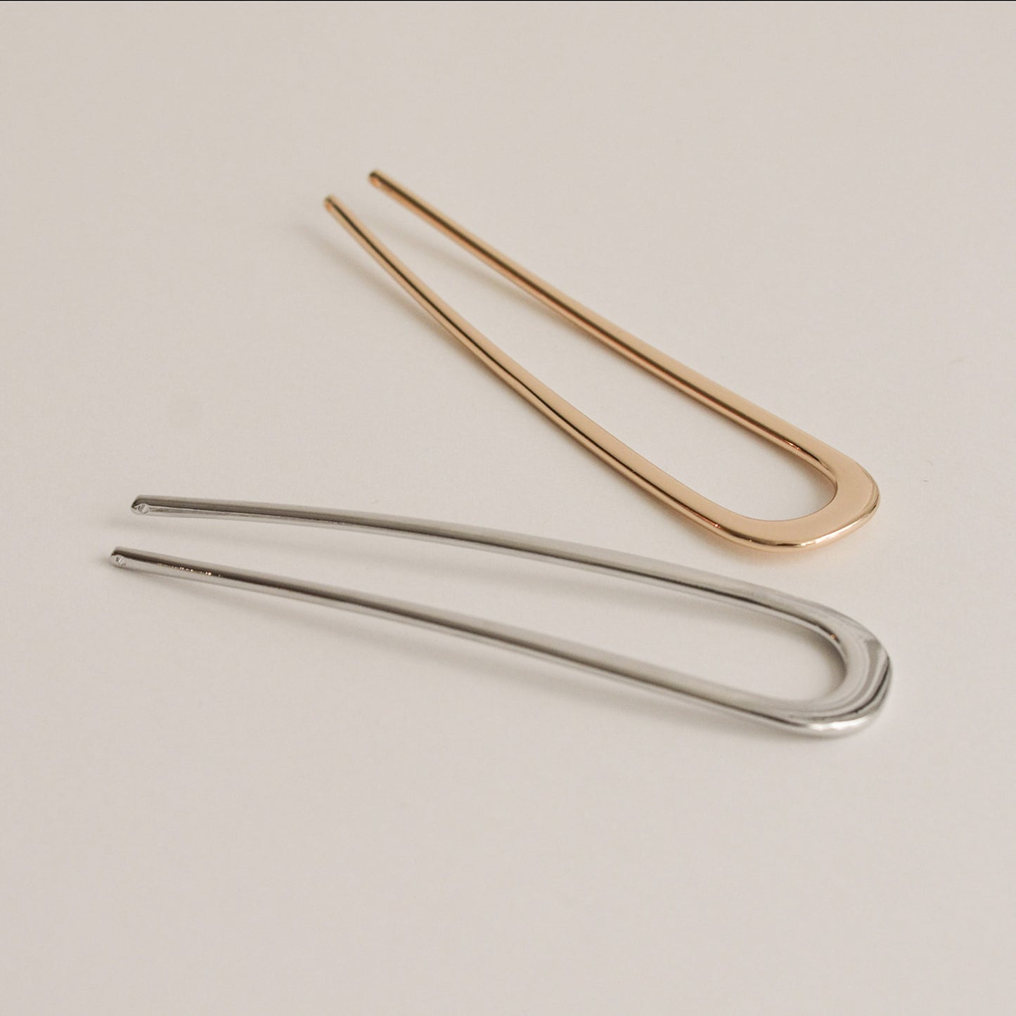 gold and silver u-shaped hair sticks made of alloy