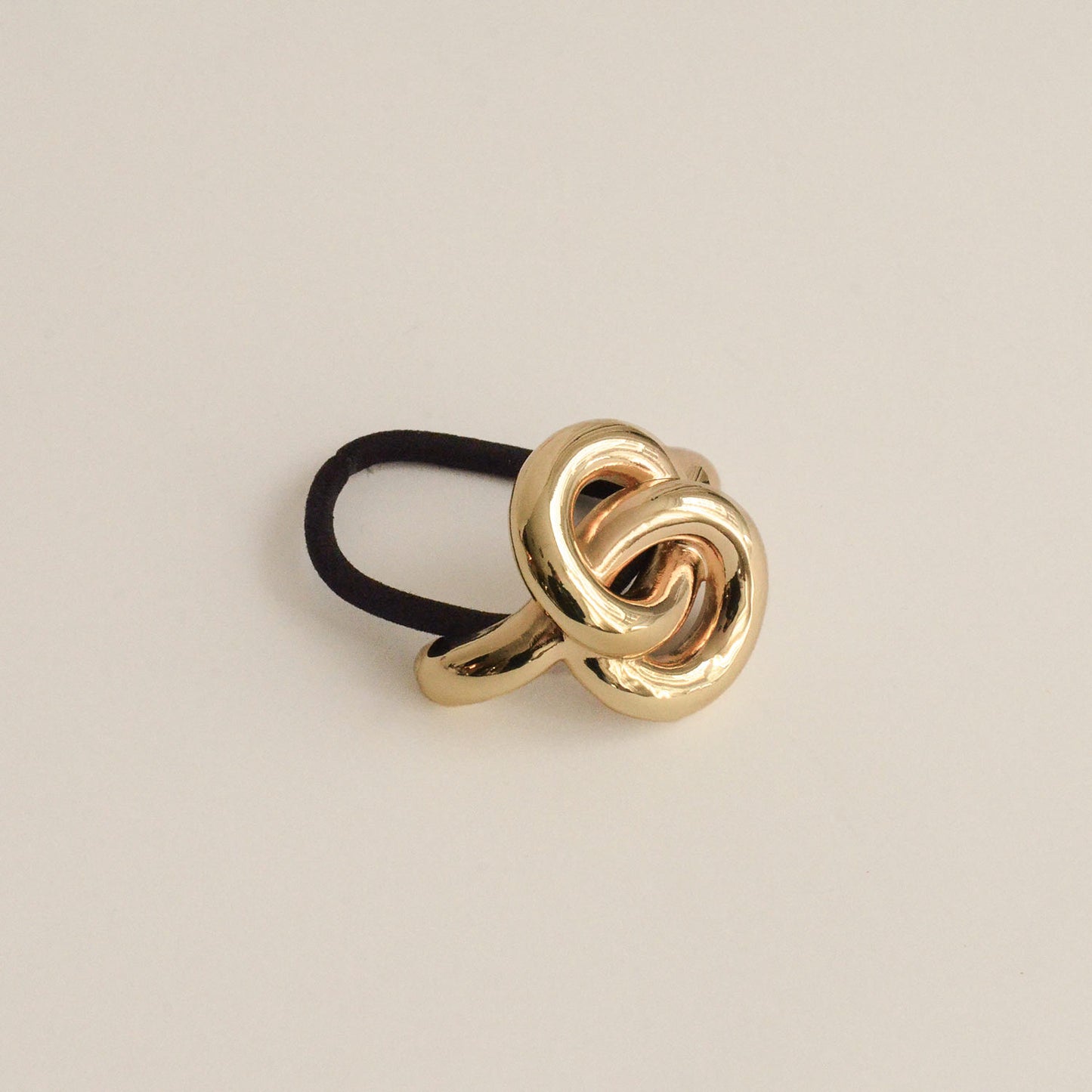Ponytail hair tie with gold eternal loop