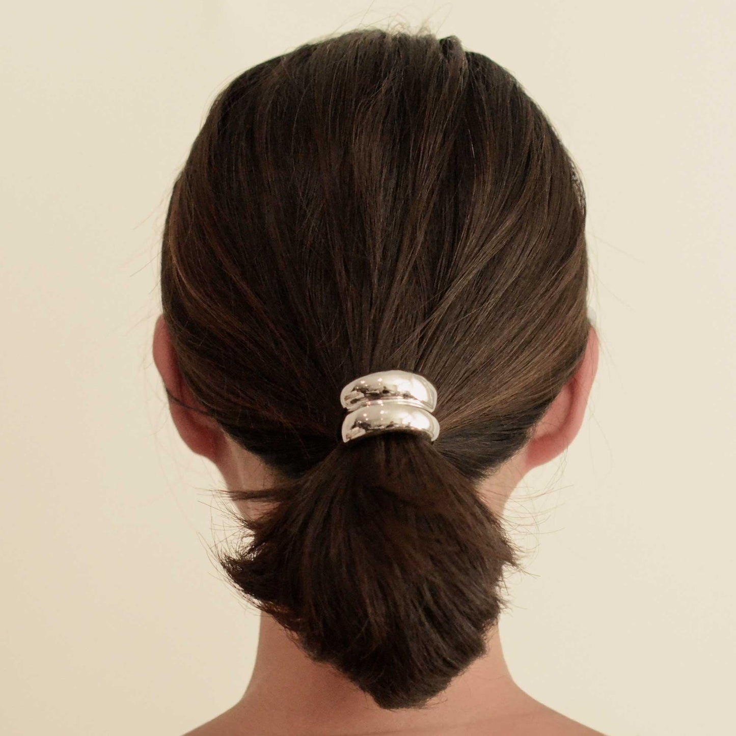 a lady with mini silver hair cuff tie