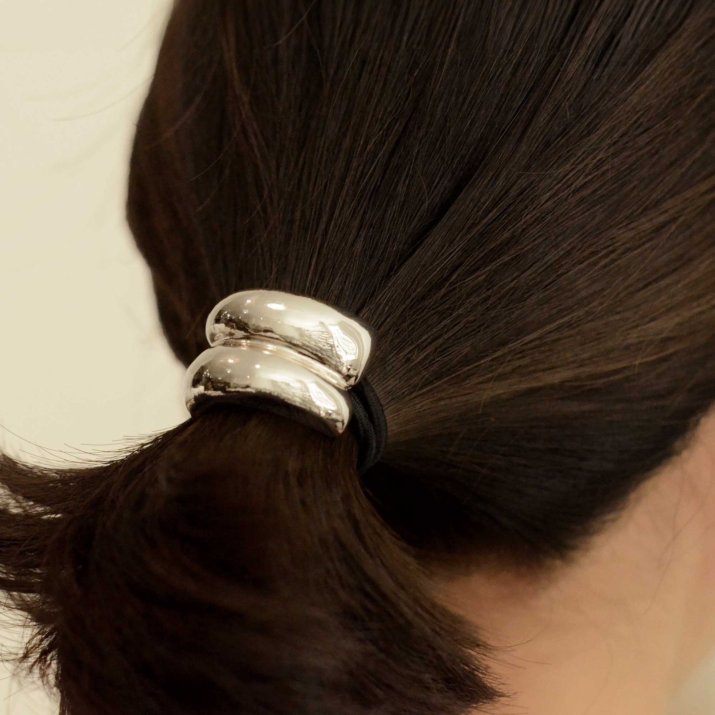 a lady wearing mini double cuff hair tie