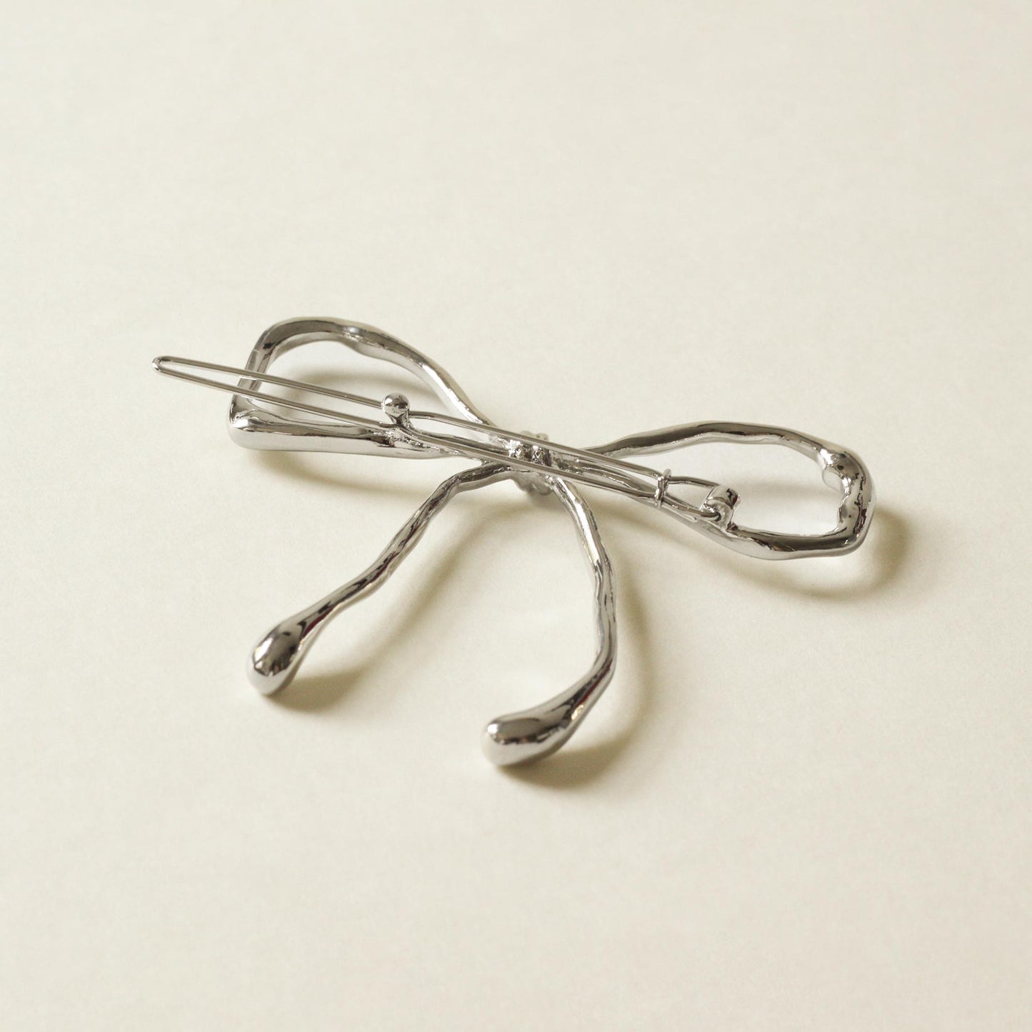 silver bow barrette hair clip with shiny finish