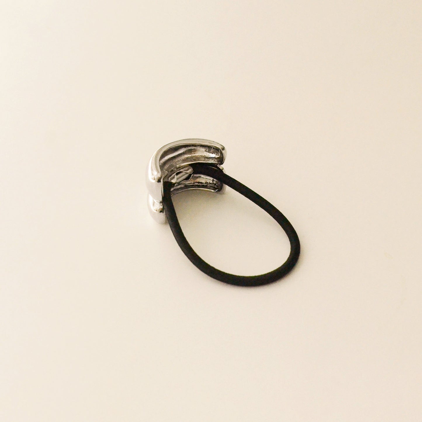 back side of hair tie with silver double cuff