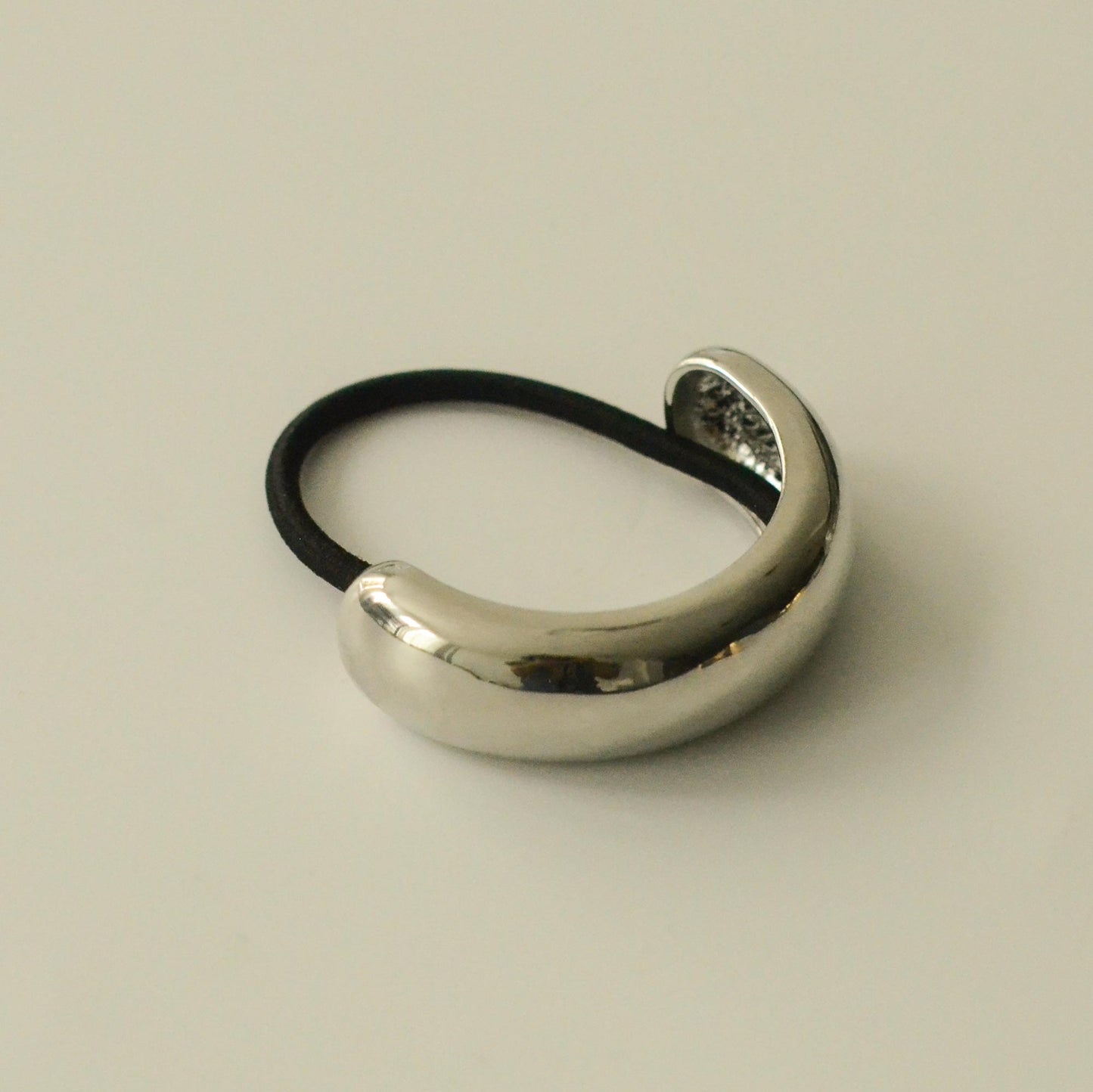 front view of silver metal cuff hair tie