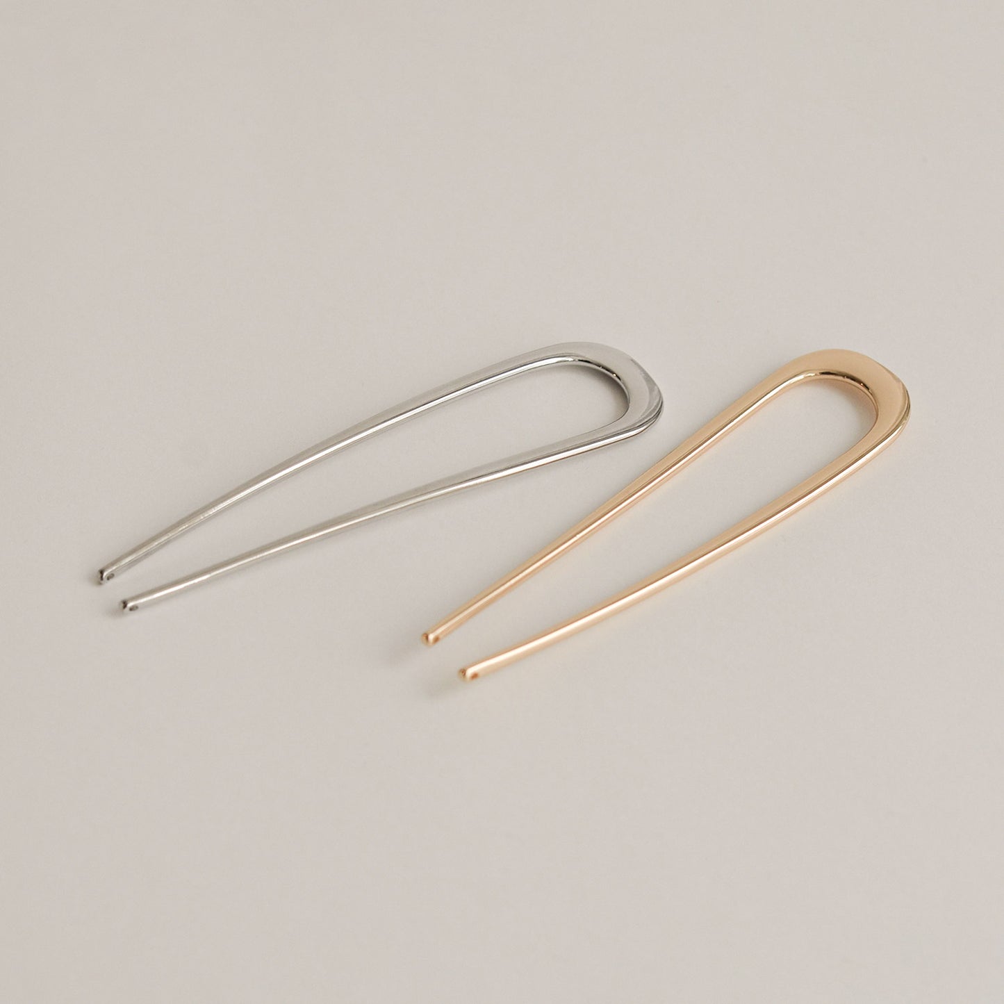 silver and gold bent u-shaped hair sticks