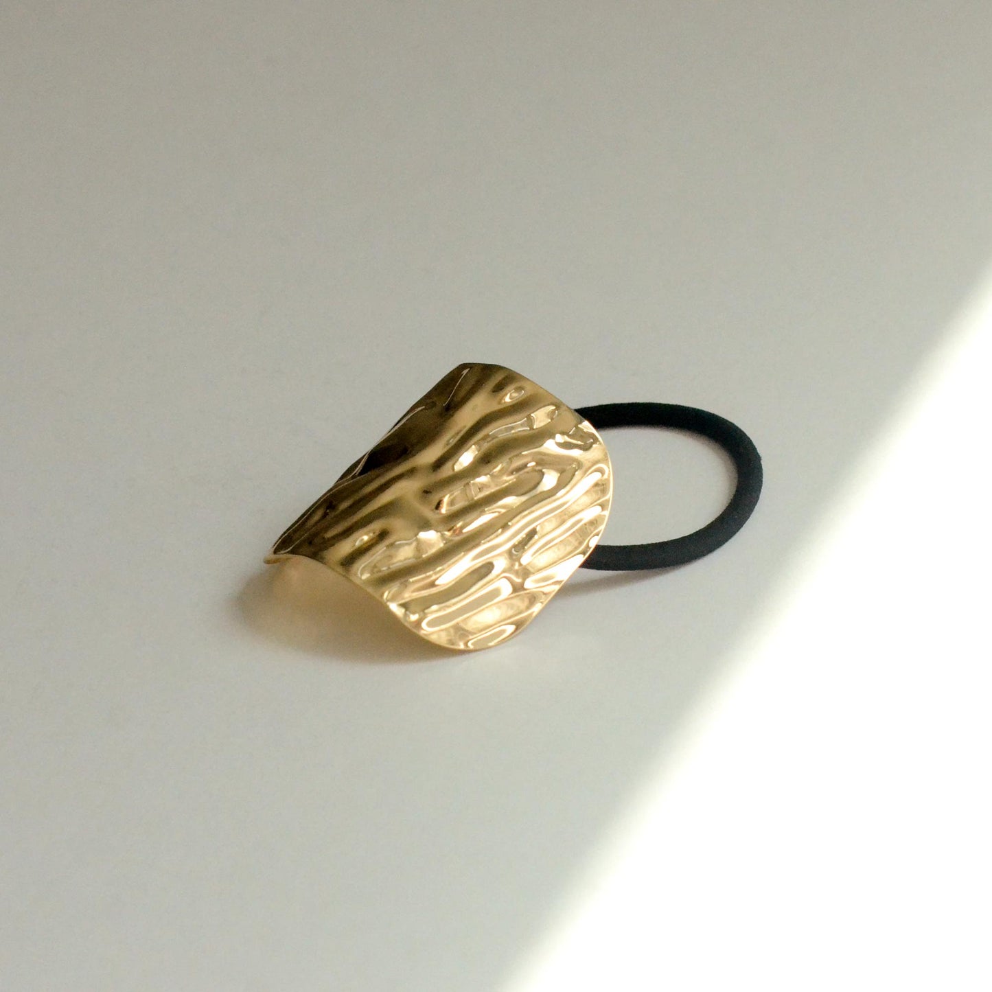 Gold hair cuff with textured surface