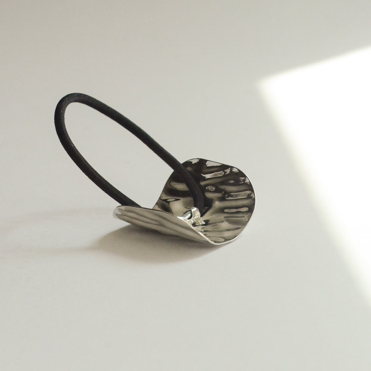 Metal hair cuff tie with textured surface