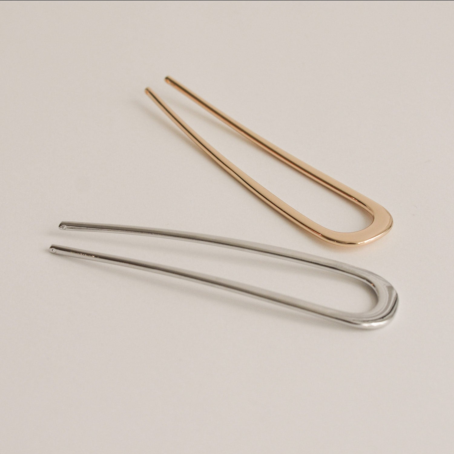 gold and silver u-shaped hair sticks made of alloy