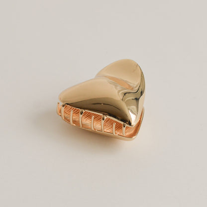 gold hair claw clip with the shape of heart