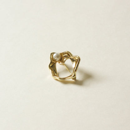 organic shaped metal brooch with pearl stud