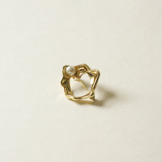 organic shaped metal brooch with pearl stud