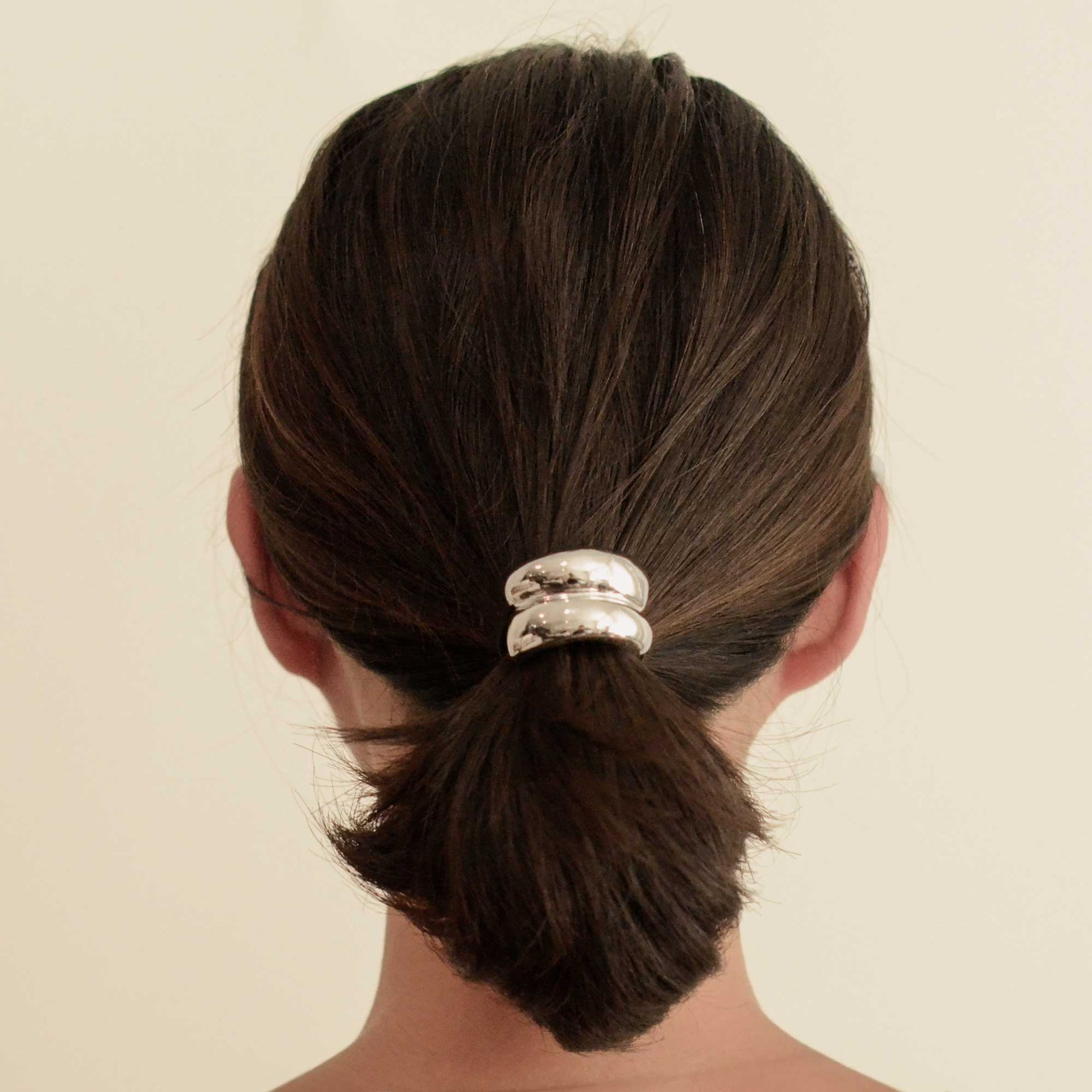 a lady with mini silver hair cuff tie 