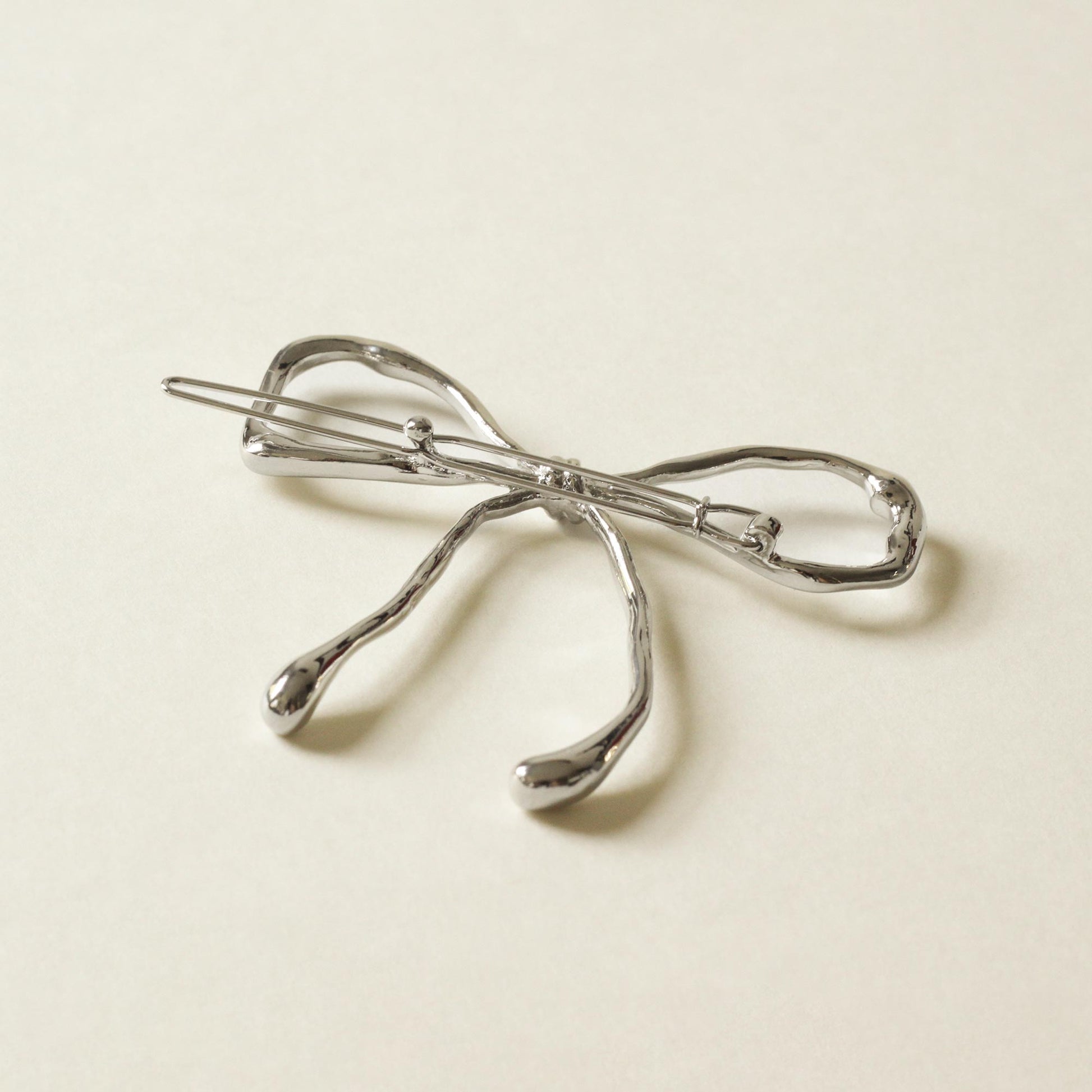 silver bow barrette hair clip with shiny finish