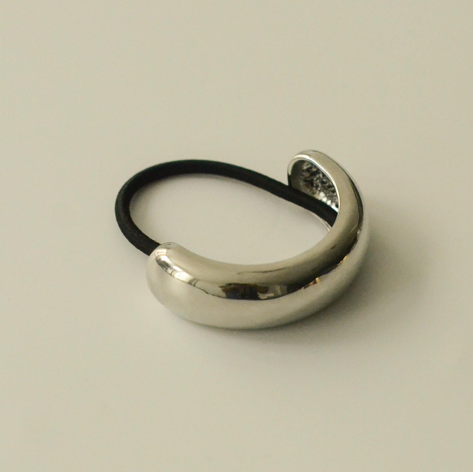 front view of silver metal cuff hair tie