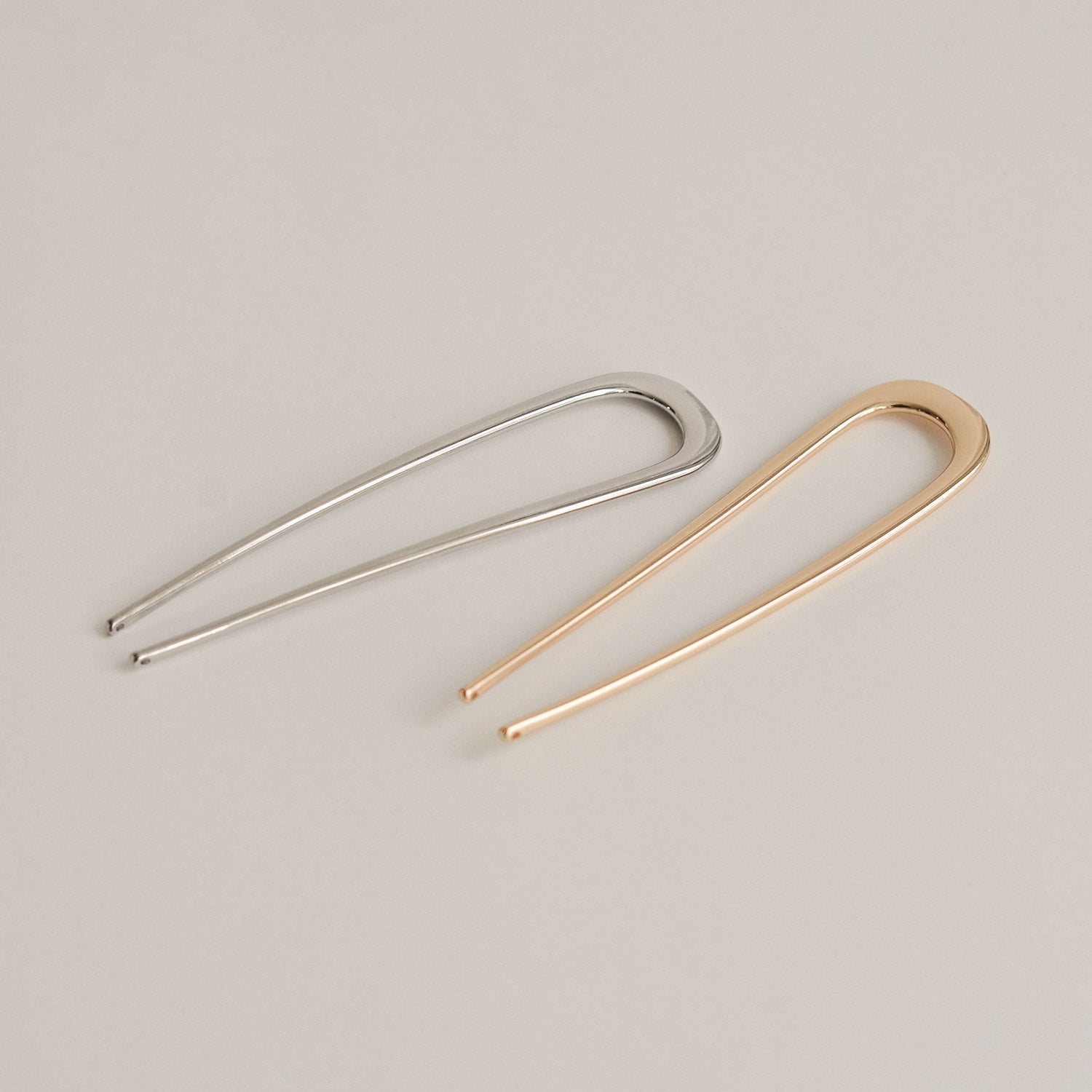silver and gold bent u-shaped hair sticks