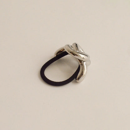a hair cuff tie with silver eternal loop