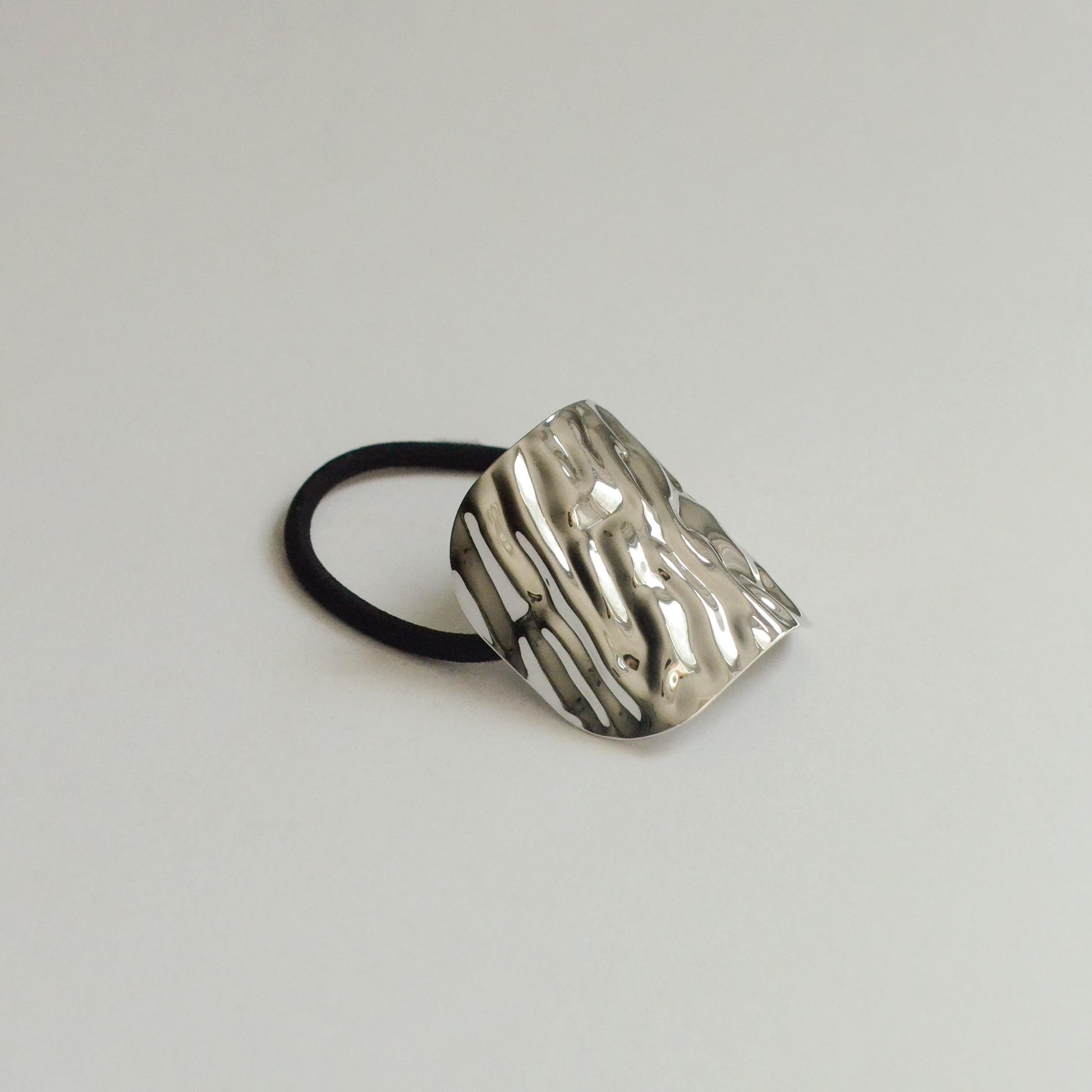 Metal hair cuff with textured surface 