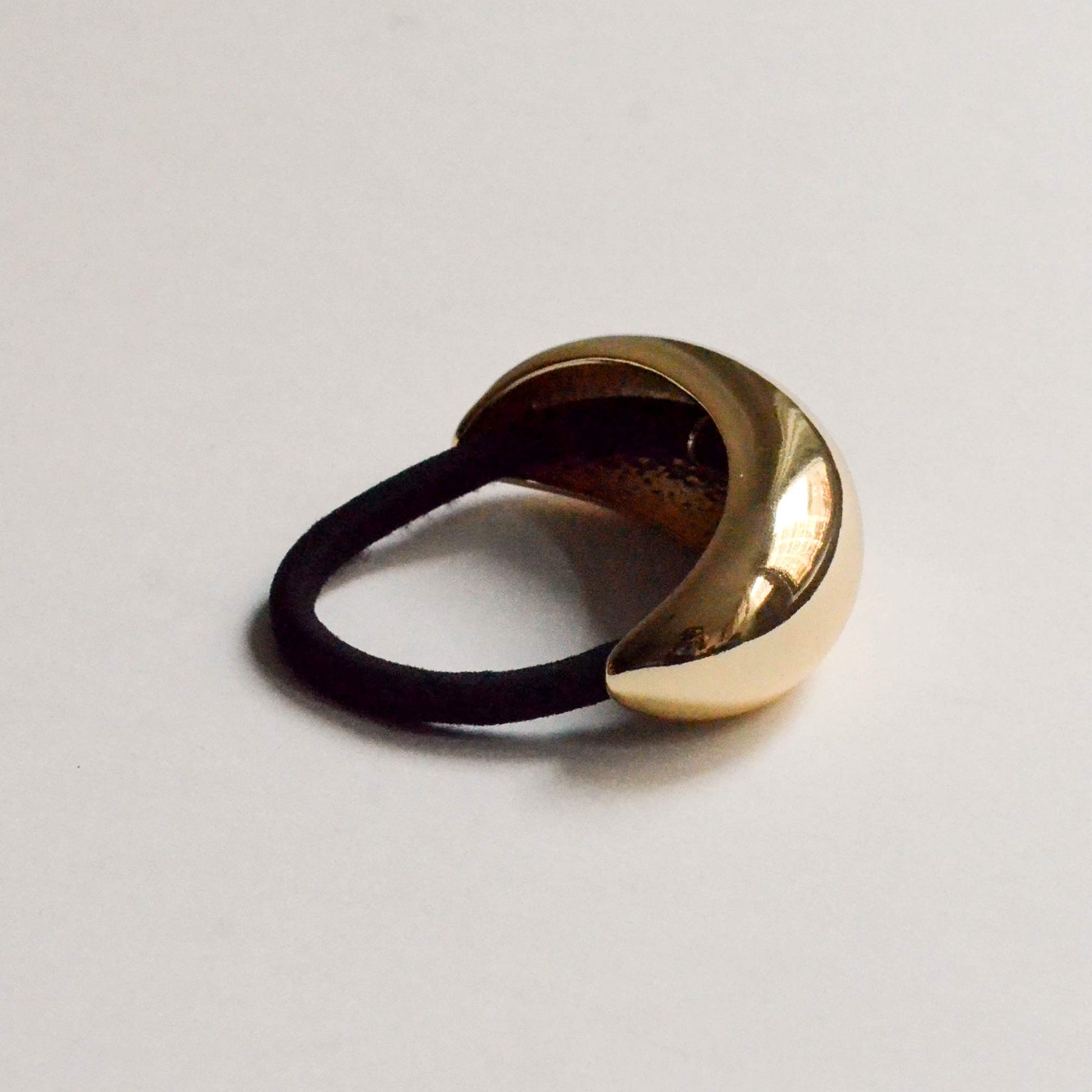 Hair cuff tie with a wide crescent design in gold